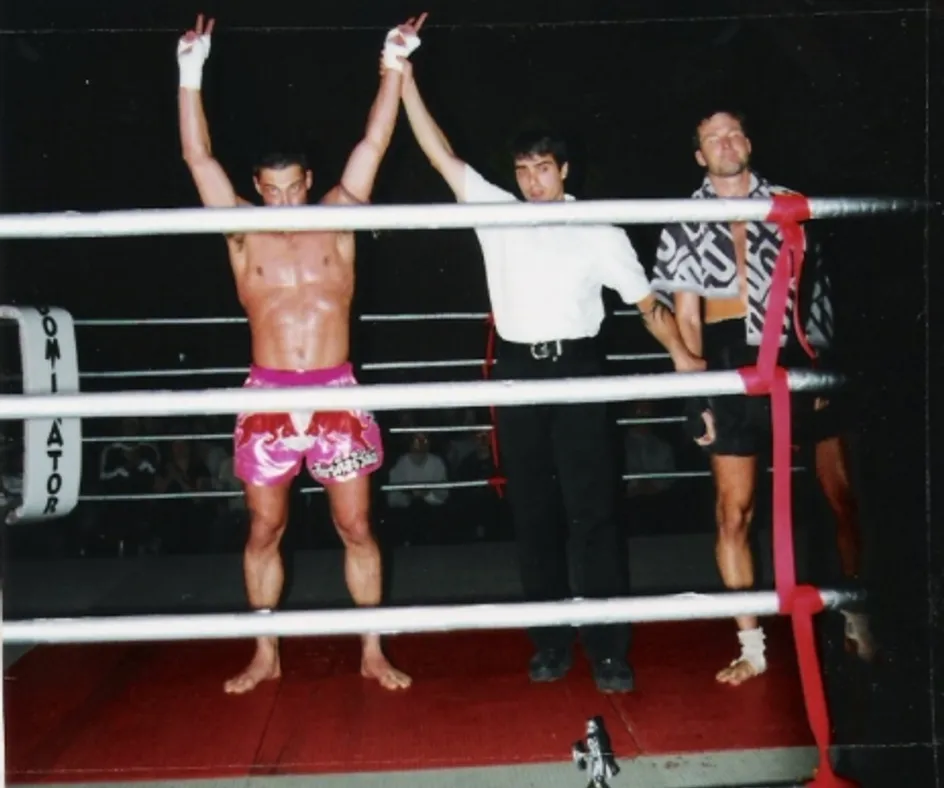 Thomas Larsen with his arm raised in the ring after a win by knockout